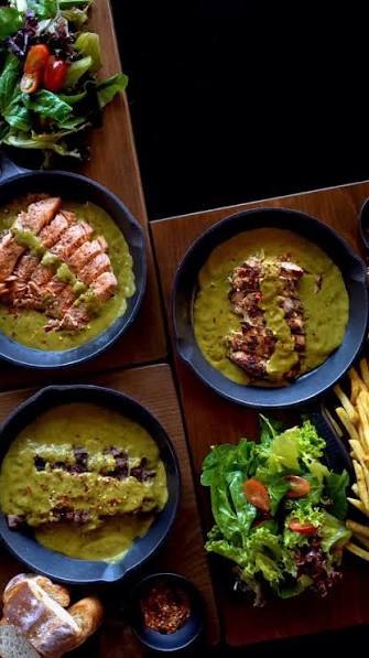 Grilled dishes with green sauce