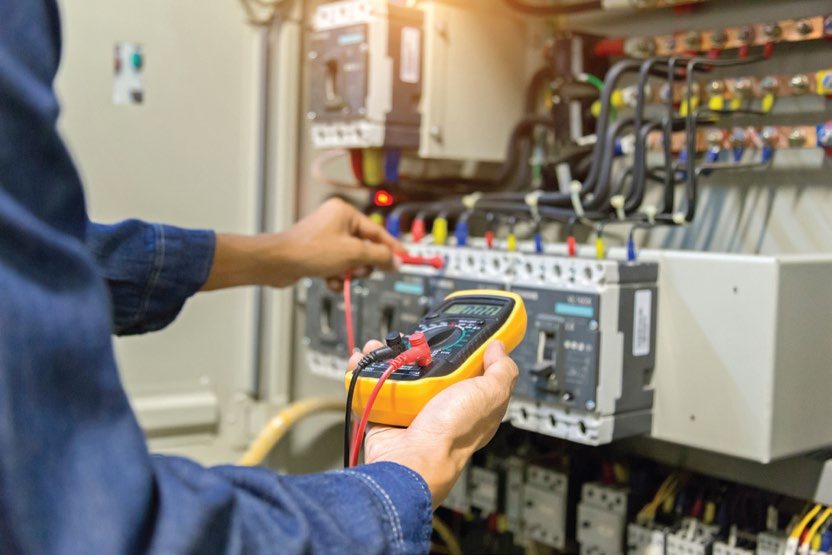 Technician testing a panel